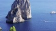 Yachts anchored in Le Faraglioni in Capri island; Italy.