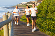 family running by the beach