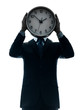 business man holding clock silhouette