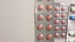 Hand with medicine blister packages