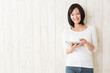 beautiful asian woman using tablet computer