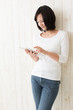 beautiful asian woman using tablet computer
