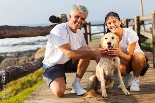 Photo: sporty middle aged couple and pet dog sporty middle aged couple and pet dog