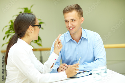 Photo: Smiling to colleague Smiling to colleague