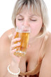 beautiful young blond woman drinking beer