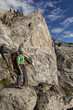 Climber scales a cliff.
