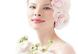 fashion model with hairstyle and pink flowers in her hair.