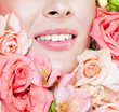 Photo: beautiful woman's face, surrounded by flowers beautiful woman's face, surrounded by flowers