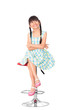 Photo: Portrait of happy little asian girl sitting on high chair Portrait of happy little asian girl sitting on high chair