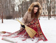 Smiling woman cleans red carpet with snow