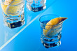 gin with lemon on a glass table