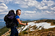hiker at the top of a rock enjoy sunny day