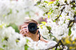 Photo: Pretty female photographer outdoors on a lovely spring day Pretty female photographer outdoors on a lovely spring day
