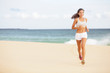 Photo: Running woman jogging on beach Running woman jogging on beach