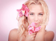 Photo: Blond woman with pink orchid Blond woman with pink orchid