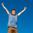 Photo: Young boy with open arms outdoors. Young boy with open arms outdoors.