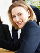 Business woman in a meeting takes the minutes