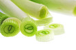 Cutting young onion on white background. Close-Up. Isolated.