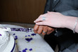 Photo: Bride and groom cutting cake closeup Bride and groom cutting cake closeup