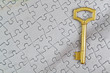 Concept picture golden key to the puzzle. Close-up.