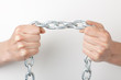 hands holding a chain. isolated on white background