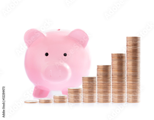 Photo: Pink piggy bank and Stacks of money coins Pink piggy bank and Stacks of money coins