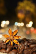 Coffee and Star Anise on sackcloth background with night lights