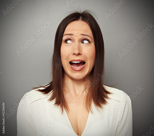 Photo: scared woman looking at something scared woman looking at something