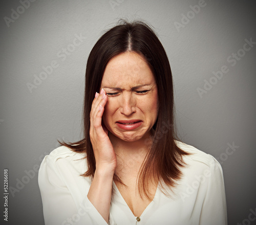 Photo: young brunette is crying young brunette is crying