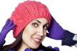 Portrait of beautiful happy woman in winter hat
