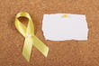 Yellow Ribbon and Blank Card on Cork Board