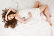 young woman on bed