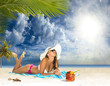 Photo: woman sunbathing on a beach woman sunbathing on a beach