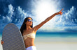 surfer girl with surfboard at a beach