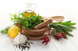 fresh herbs with mortar and pestle