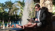 Young businessman working with documents and laptop