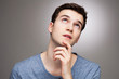 Young man wondering