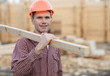 Construction worker with plank