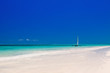 wooden boat in crisp blue water