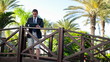 Video: Businessman with tablet computer in exotic resort Businessman with tablet computer in exotic resort