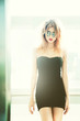 girl in sunglasses posing in elevator