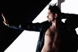 young handsome man in leather jacket with naked torso