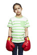 Photo: Young girl wearing boxing gloves sad and upset Young girl wearing boxing gloves sad and upset