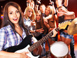 Band playing musical  instrument.