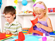 Child cutting out scissors paper.