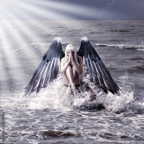 Photo: woman with dark angel wings woman with dark angel wings