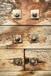 nuts and bolts on weathered wood