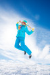 Girl jumping in snow