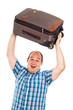 Ecstatic traveler lifting up his luggage