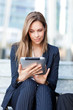 Successful young businesswoman using a laptop